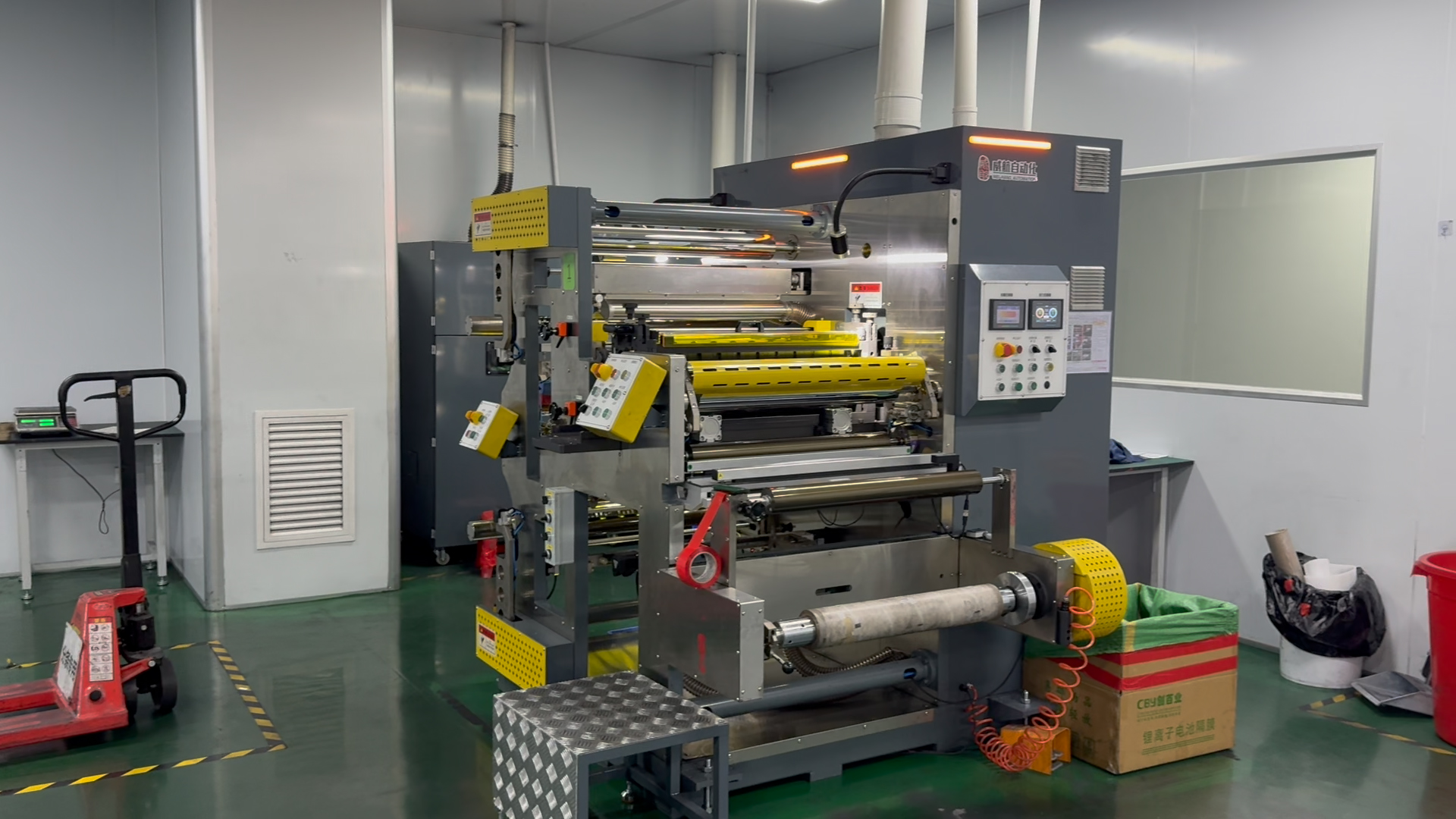 Battery calendering and slitting machine