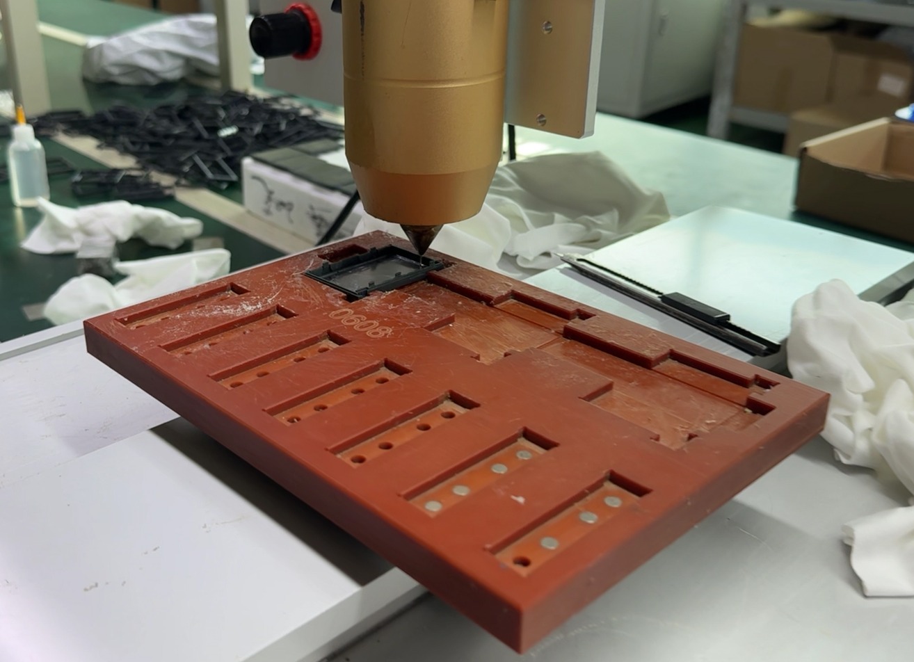 Battery filling and sealing fixture